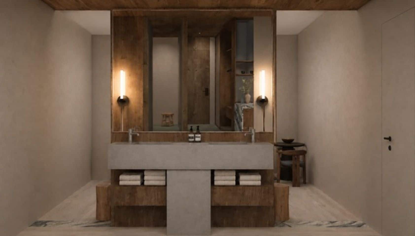 Un baño moderno con un mueble de tocador de madera, un espejo grande y dos luces empotradas.