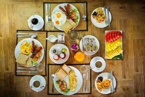 A breakfast buffet with various dishes and beverages. - SHA Extra Plus Grand Villa Luxury Time (Choeng Thale)