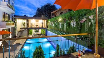 Outdoor pool, open 7:00 AM to 10:00 PM, sun loungers