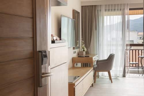 Grand Deluxe King with Balcony | Living area | 52-inch LCD TV with cable channels, TV