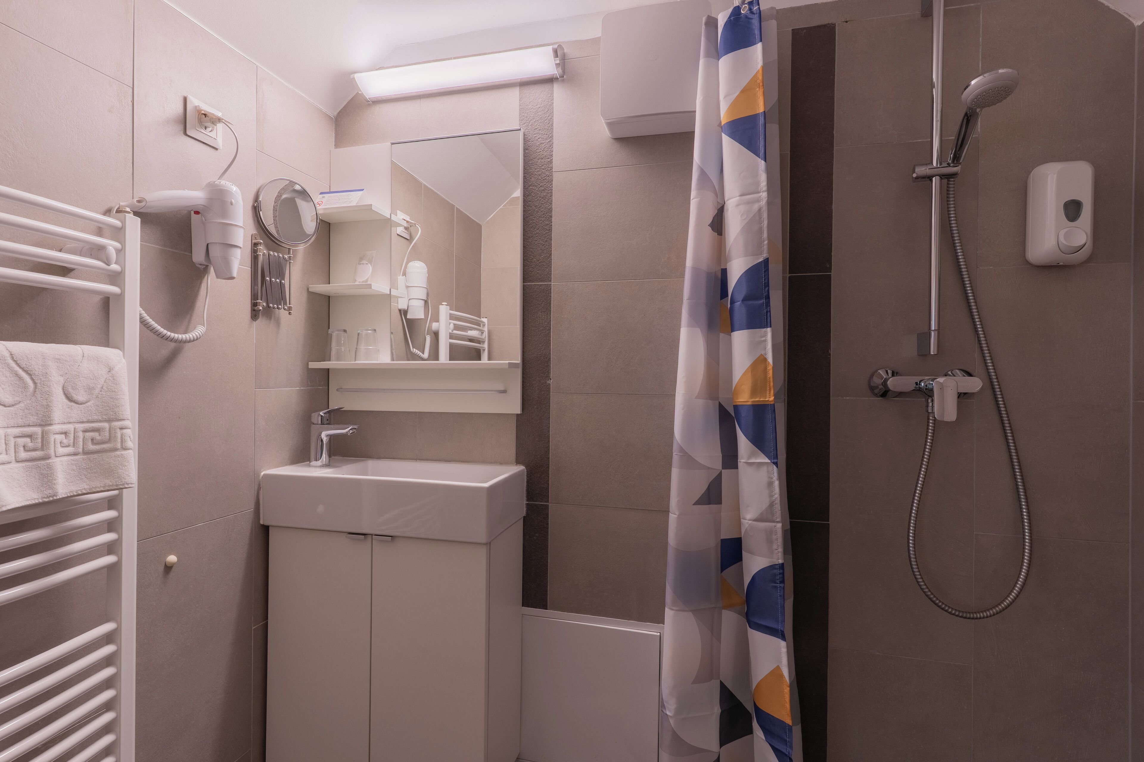family double room | bathroom | shower, hair dryer, towels
