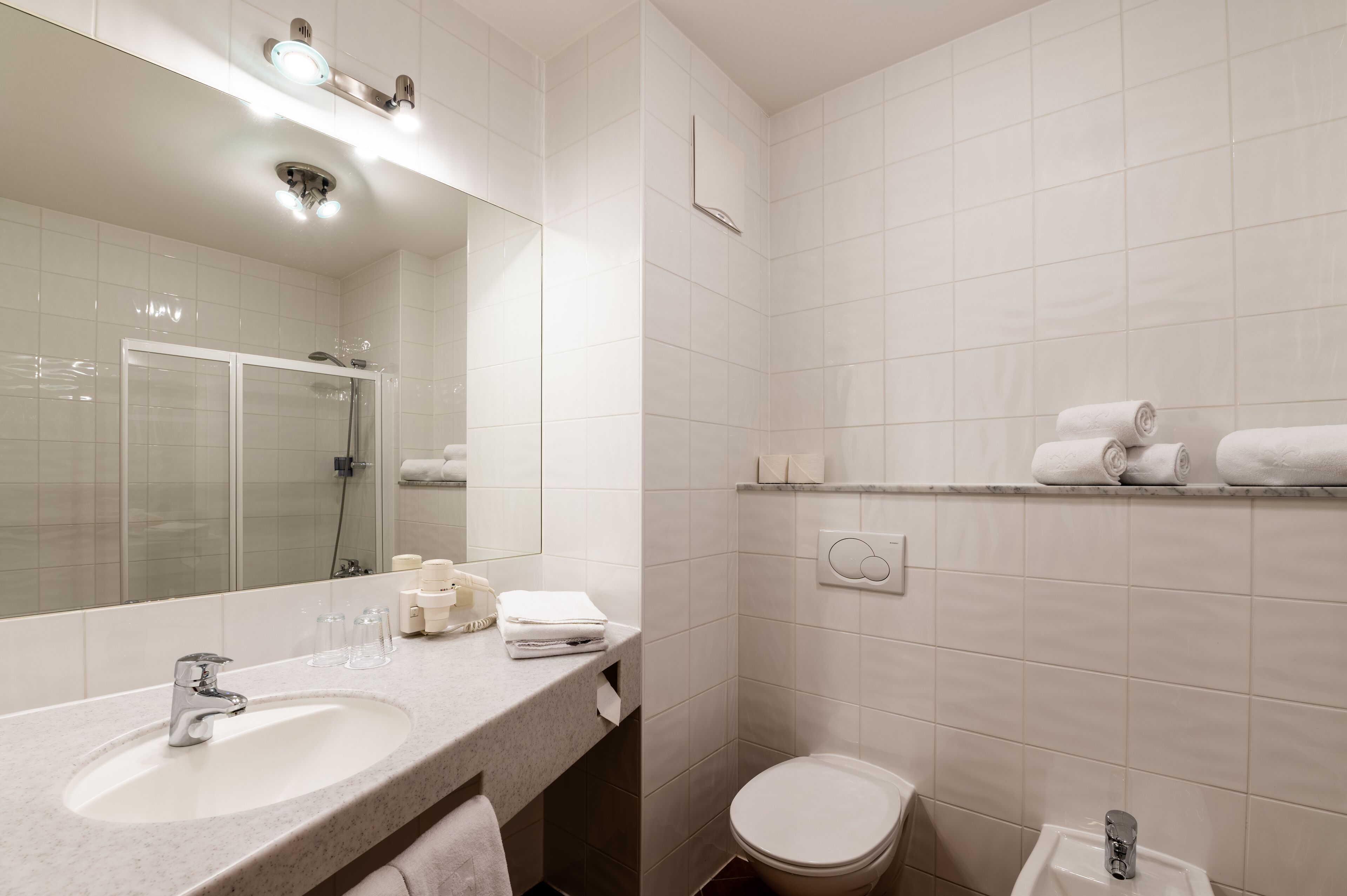 free toiletries, hair dryer, towels, shampoo