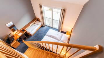 Standard Quadruple Room, Multiple Beds, Balcony | In-room safe, desk, blackout drapes, soundproofing