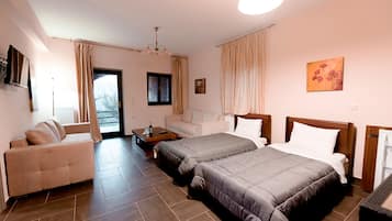 Triple Room, Mountain View | Minibar, in-room safe, individually decorated, desk