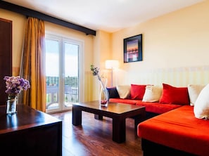Junior Suite, Jetted Tub | Living area | Flat-screen TV
