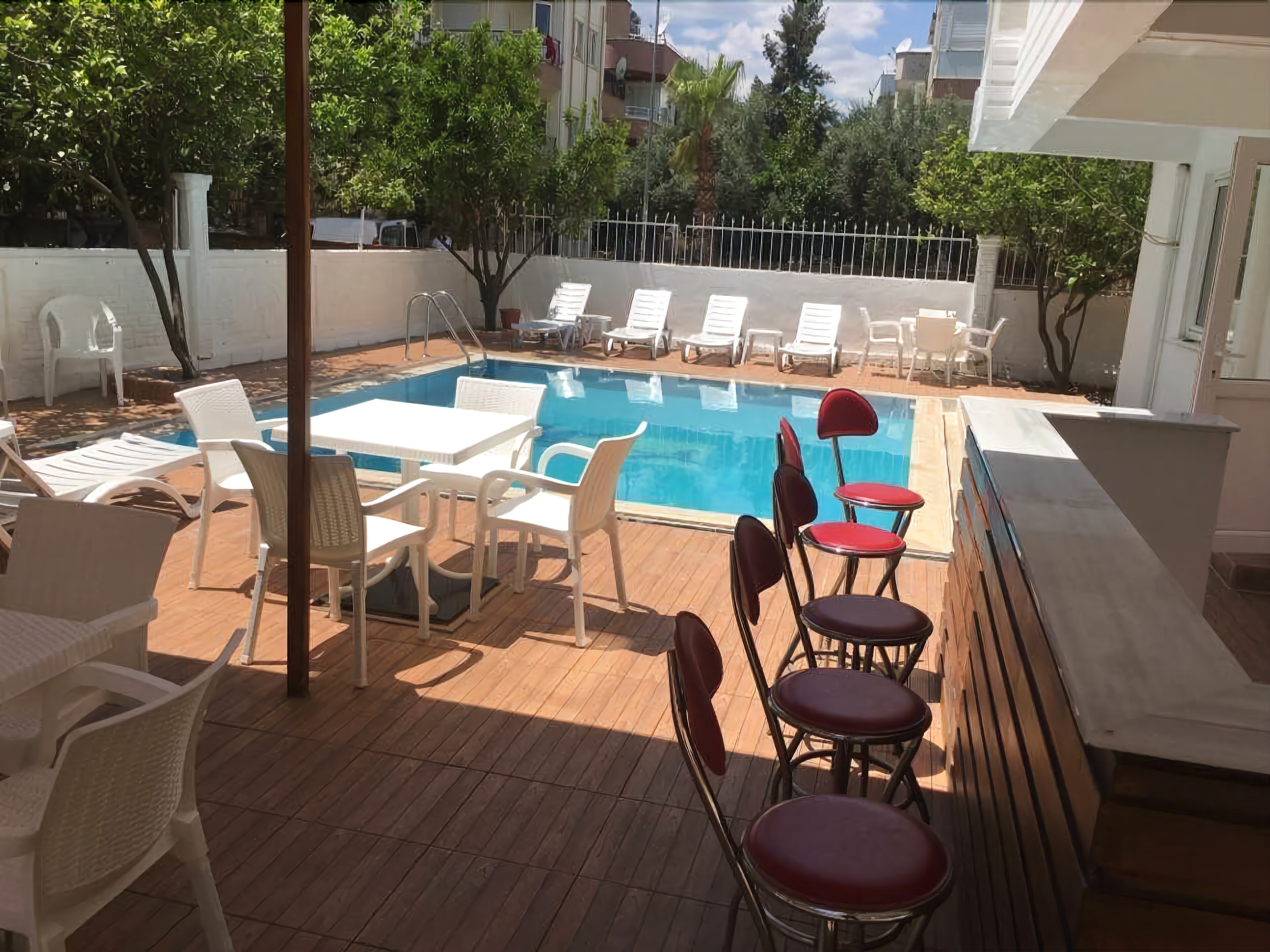 seasonal outdoor pool, open 10 am to 10 pm, pool umbrellas