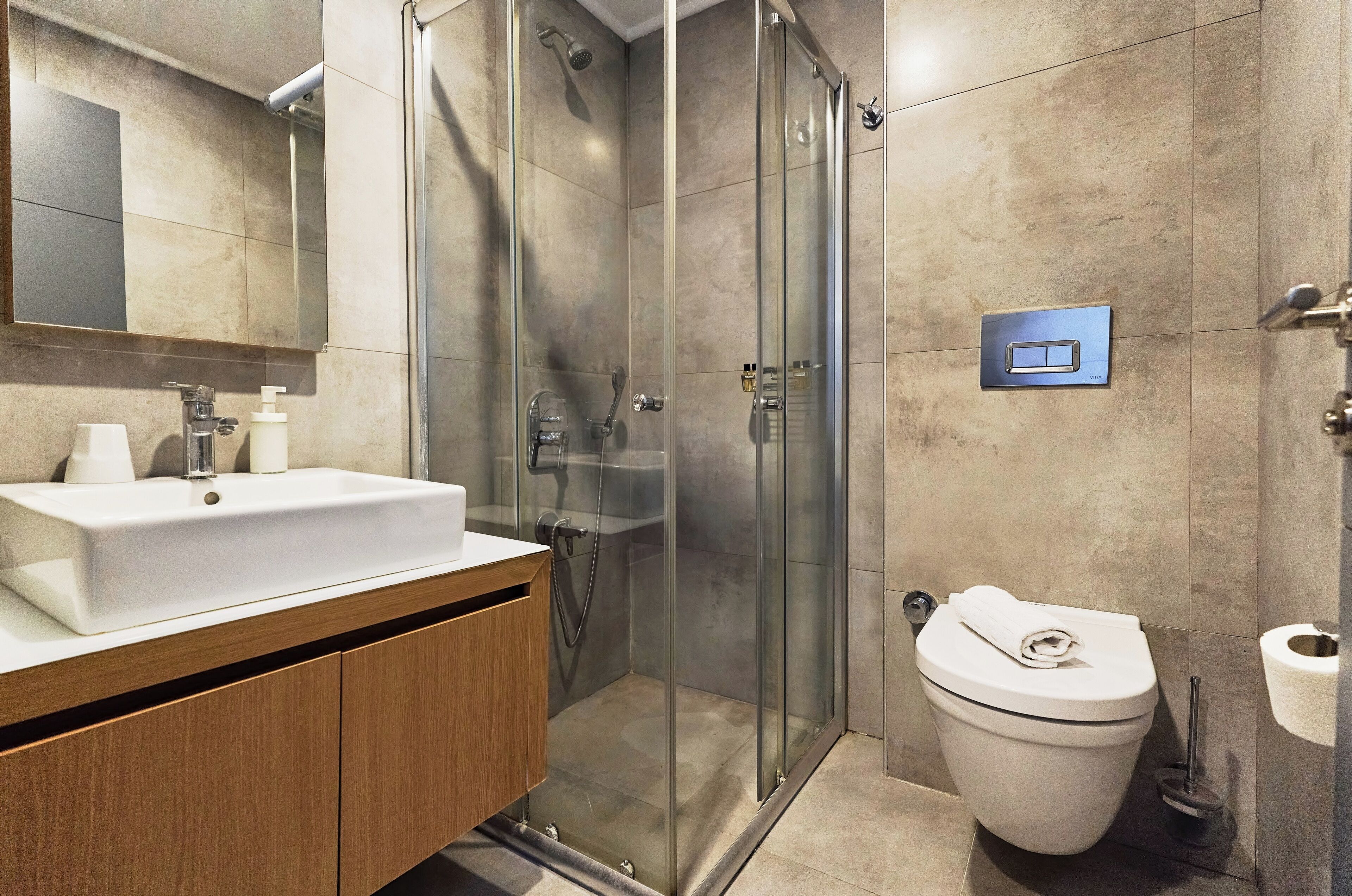 shower, hair dryer, slippers, towels