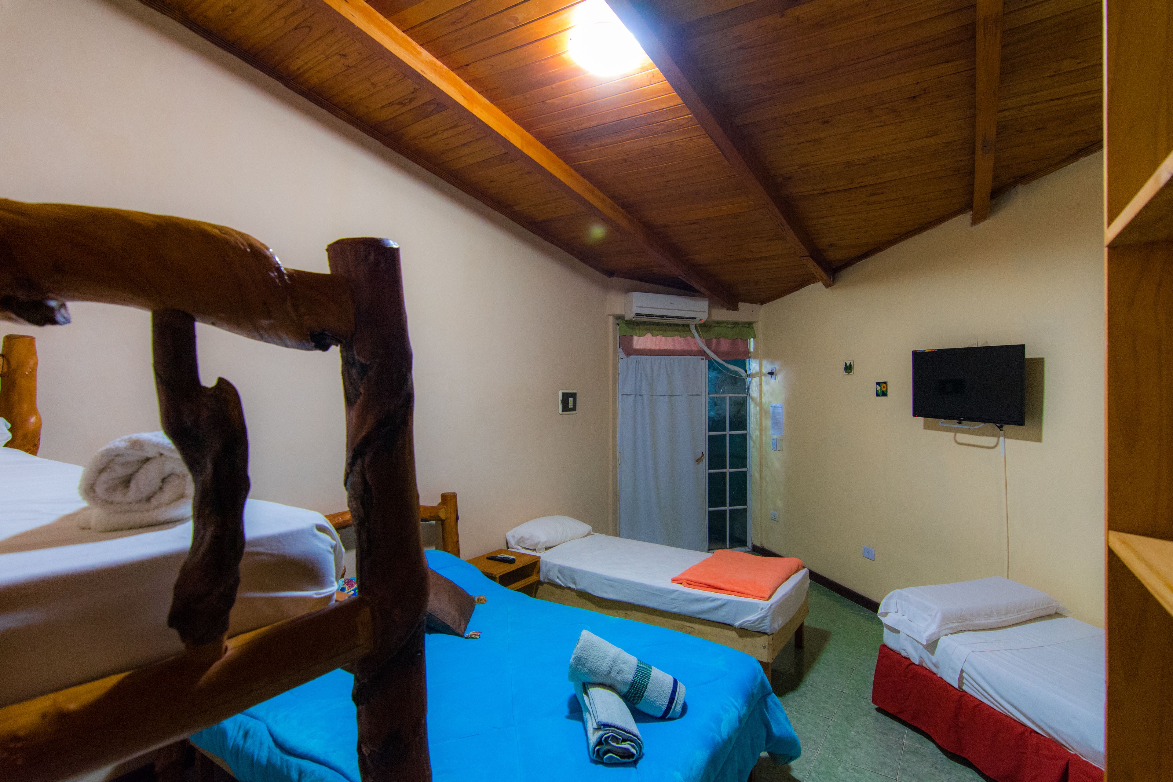 family room, multiple beds | iron/ironing board, rollaway beds, free wifi, bed sheets