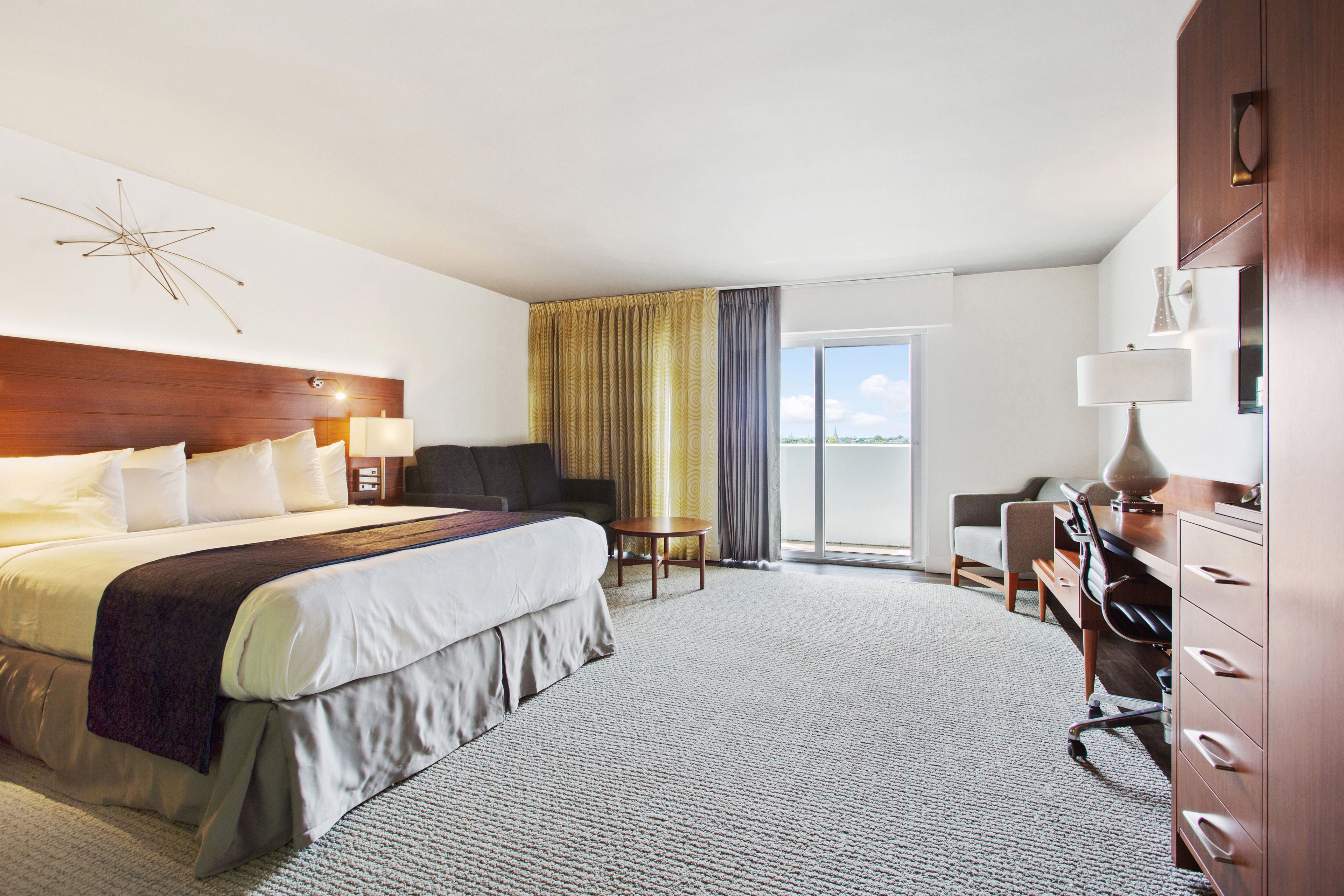 deluxe room, 1 king bed, balcony | in-room safe, desk, laptop workspace, blackout curtains