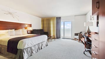 Deluxe Room, 1 King Bed, Balcony | In-room safe, desk, laptop workspace, blackout drapes