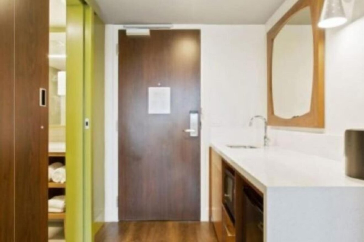 Shower, designer toiletries, hair dryer, towels