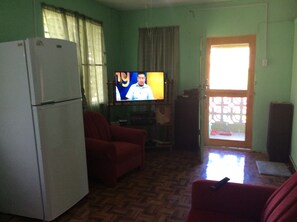 Standard Apartment, 1 Bedroom | Living area | Flat-screen TV