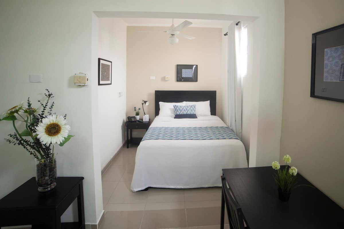 Deluxe Room | Pillowtop beds, in-room safe, desk, iron/ironing board