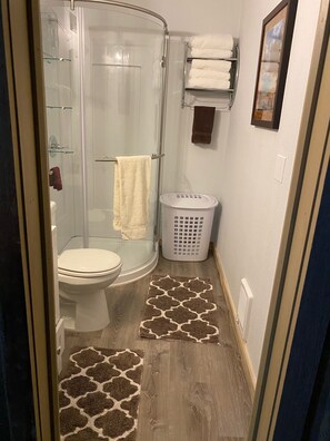 Shower, towels, soap, toilet paper