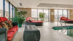 A pool area with lounge chairs and a small pool. - Crashing surf, steps to the sand, Pier BEST CONDO IN OLD ORCHARD BEACH (Old Orchard Beach)