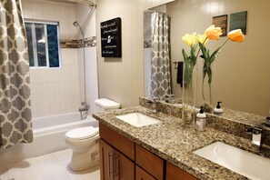 Combined shower/bathtub, hair dryer, towels, soap