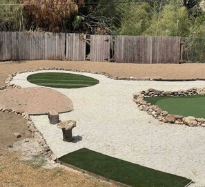 A miniature golf course with sand traps and artificial turf. - Bachelor  Party HQ, pickleball/golf, 16 beds. DT (Austin)