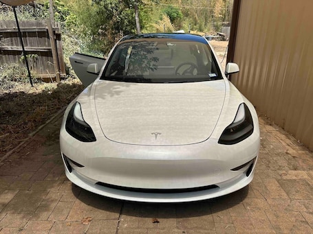 A white sports car parked in a driveway.. Bachelor Pad 18 beds, Golf, Pool, Pickleball, 5min to 6th street