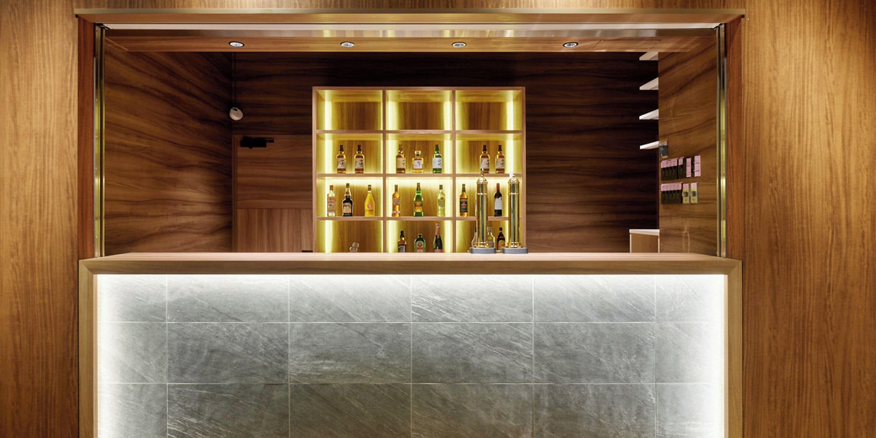A bar area with a wooden interior and a tiled counter.