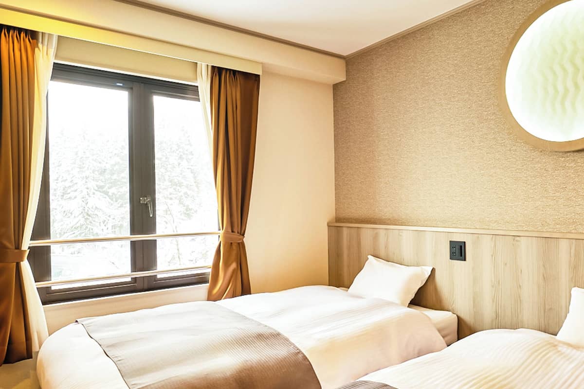 Habitación Deluxe con 2 camas individuales | Escritorio y wifi gratis