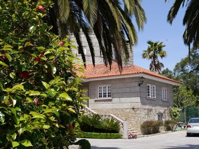 stone chalet with pool and garden areas