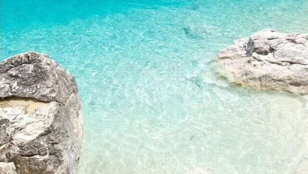 A coastal landscape with clear turquoise waters, rocky formations, and a cliff. - Residenza Limpiddu with Swimming Pool - Ground Floor - All Comforts  (Limpiddu)