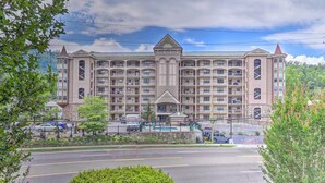 A large, multi-story hotel with a symmetrical facade, multiple balconies, and a central entrance. - Cascading Creek / Gatehouse Condos / 2BR / 1st floor / no steps (Gatlinburg)