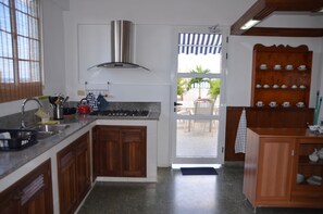 Apartment, 4 Bedrooms | Private kitchen | Fridge, microwave, oven, stovetop