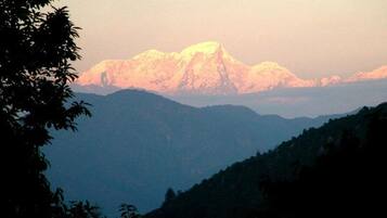 A mountain range with a prominent peak in the background.