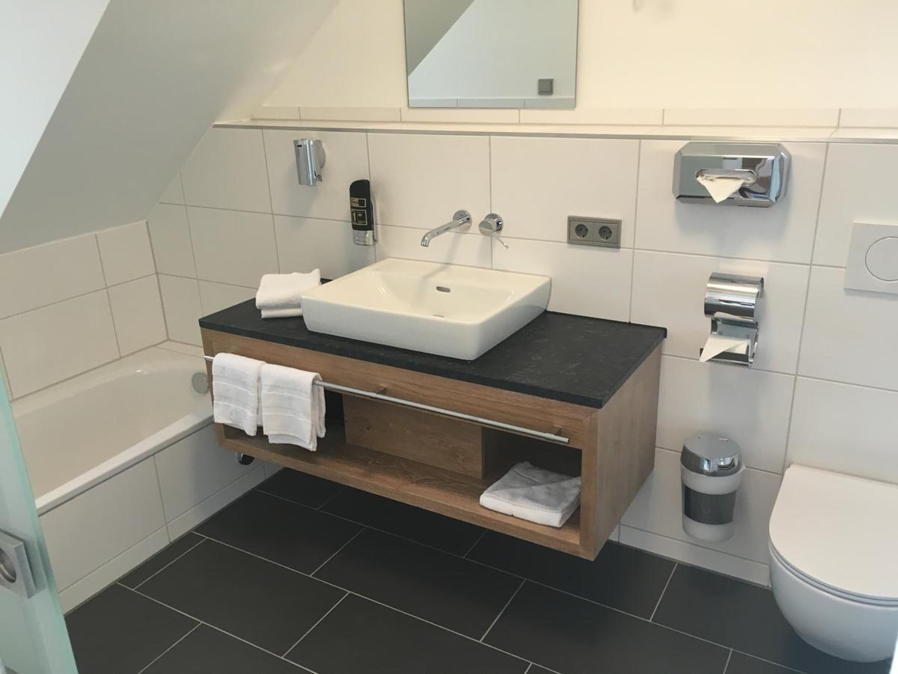 shower, free toiletries, slippers, towels