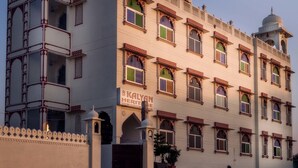 A multi-story building with a sign reading "Kalyan Heritage Hotel". - Kalyan Heritage (Jaipur)