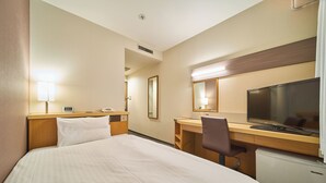 A hotel room with a large bed, a desk with a computer, a chair, a TV, and a mirror. - JR WEST GROUP VIA INN SHINOSAKA WEST (Osaka)