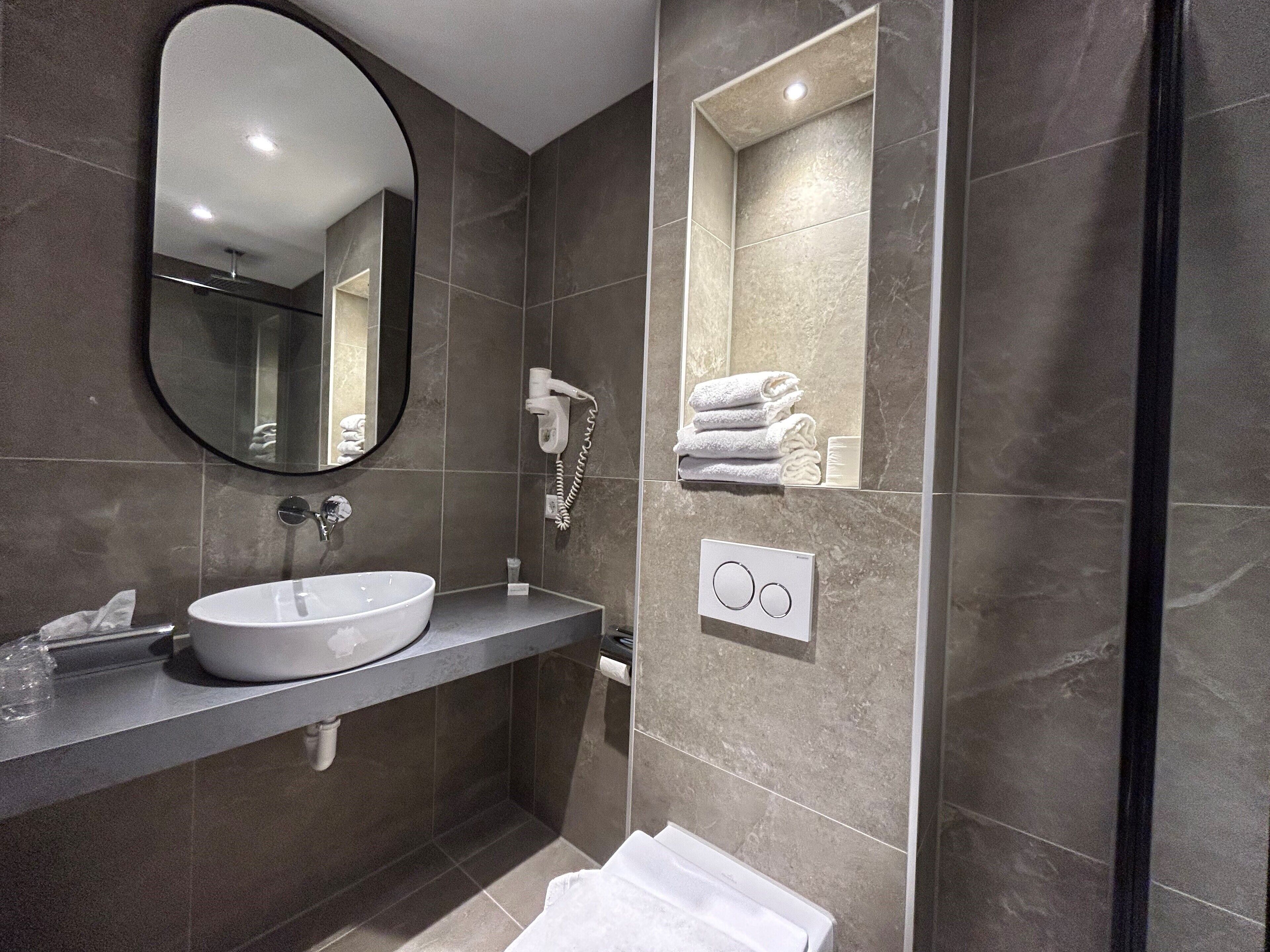 economy twin room, 2 single beds | bathroom | free toiletries, hair dryer, towels, soap