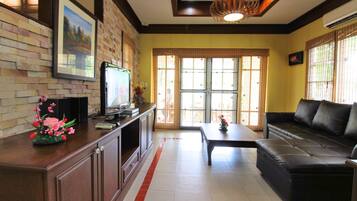 Grand Villa, Pool View | Living area | Flat-screen TV, fireplace
