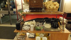 A breakfast bar with bread, condiments, and coffee-making equipment. - Formul'Eco Maubeuge (Maubeuge)