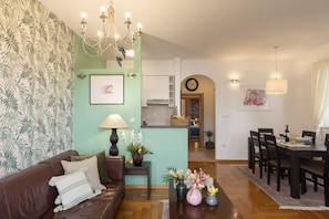 Deluxe Apartment, 2 Bedrooms, Balcony | Living area | Flat-screen TV, DVD player