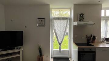 Apartment (Gite Bridoire) | Living area | Flat-screen TV