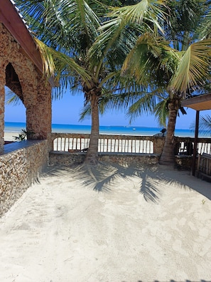 On the beach, white sand, beach umbrellas, beach towels
