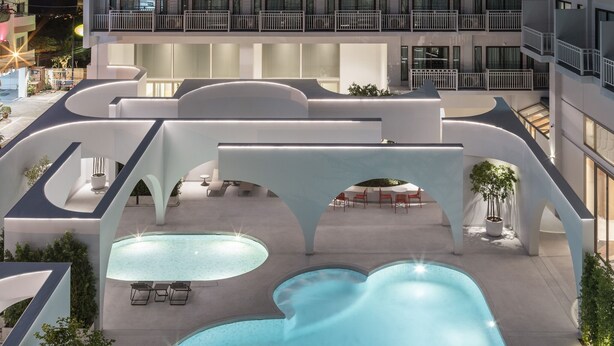 A modern hotel with a rooftop pool, outdoor seating, and a multi-level balcony. - Terra Nara (Pattaya)