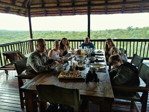 A wooden deck with a thatched roof, surrounded by lush greenery. - Elephant Game Lodge (Hoedspruit)