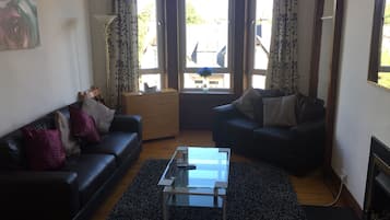 Apartment, 2 Bedrooms | Living room | Flat-screen TV, fireplace