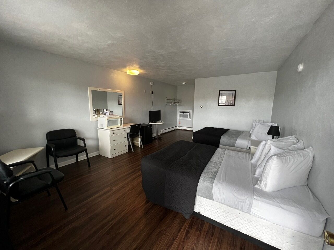 Desk, laptop workspace, blackout drapes, iron/ironing board