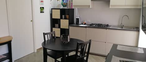 Luxury Studio, Kitchenette | Private kitchen | Fridge, stovetop, coffee/tea maker, electric kettle