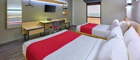 A hotel room with two beds, a desk, a chair, a TV, and a window with a view.