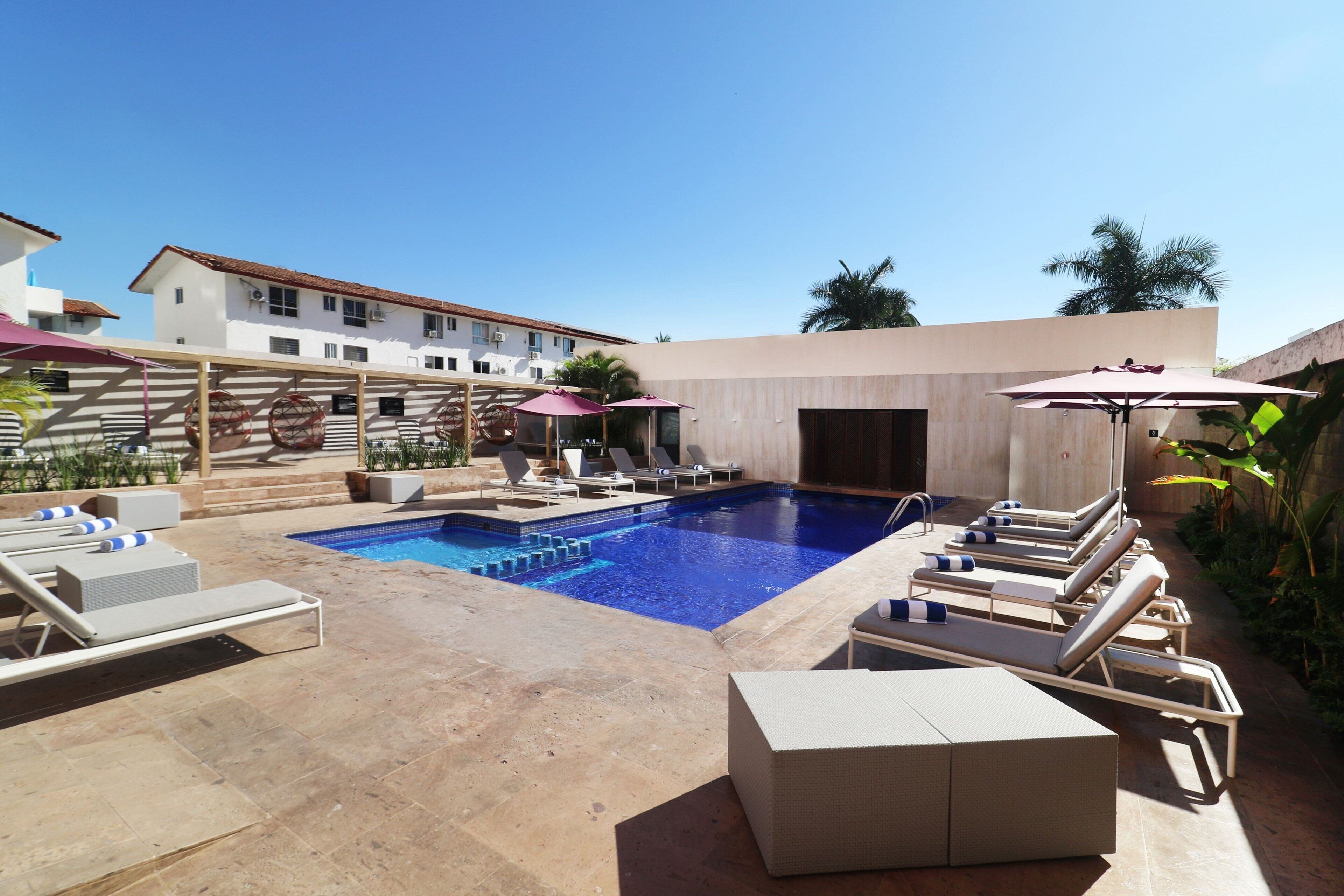 Outdoor pool, open 8 AM to 9:30 PM, pool umbrellas, pool loungers