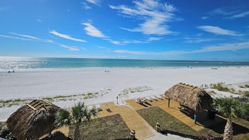 On the beach, sun loungers, beach towels