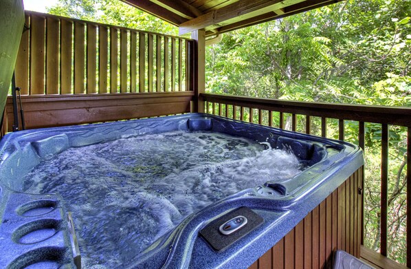 A hot tub on a wooden deck with a view of trees. - Mountain View Cabin-Pool Table-Hot Tub-Sleeps 8-Near Dollywood-Resort Pool (Sevierville)