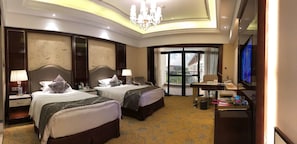A hotel room with two beds, a desk, a television, and a balcony with a view. - Tongli Lake Resort Phase2 (Suzhou)