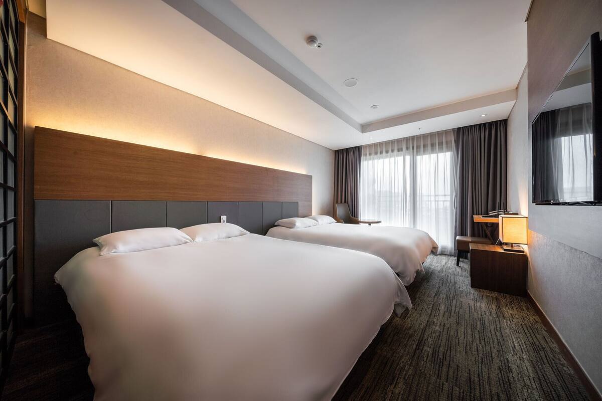 Family Double Twin Room Ocean View (2 Double Beds) | Desk, laptop workspace, blackout curtains, soundproofing