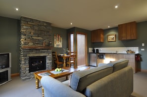 Apartment, 1 Bedroom | Living area | Flat-screen TV, fireplace - Lansdown Peaks Apartments (Wanaka)